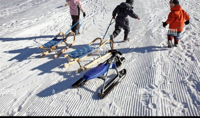 A child pulls a 15kg sled